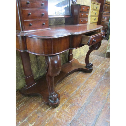 2624 - A Victorian mahogany Duchess dressing table with arched mirror, carved and shaped supports open an o... 