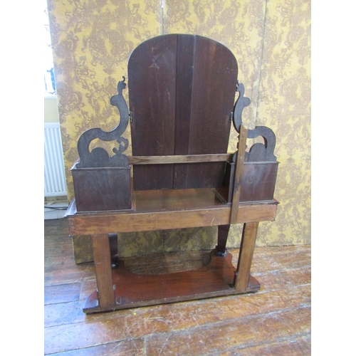 2624 - A Victorian mahogany Duchess dressing table with arched mirror, carved and shaped supports open an o... 