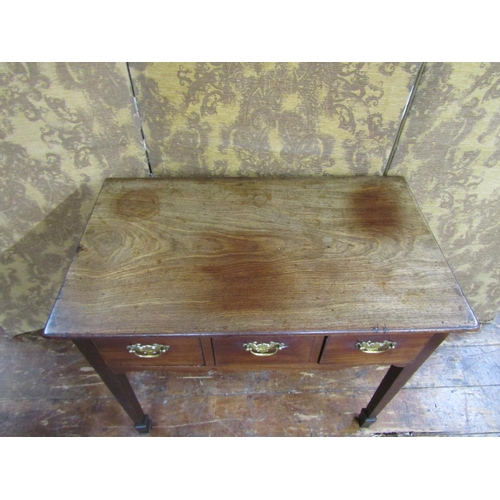 2629 - A Georgian low boy, mixed woods including fruitwood enclosing three frieze drawers on square taper l... 