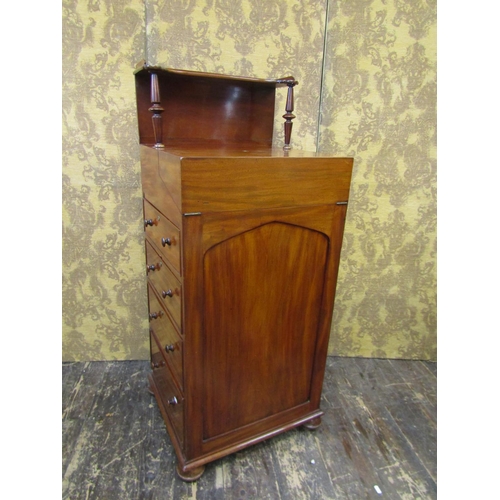 2635 - A Regency mahogany davenport of unusual form, the fold over top revealing a writing surface and thre... 