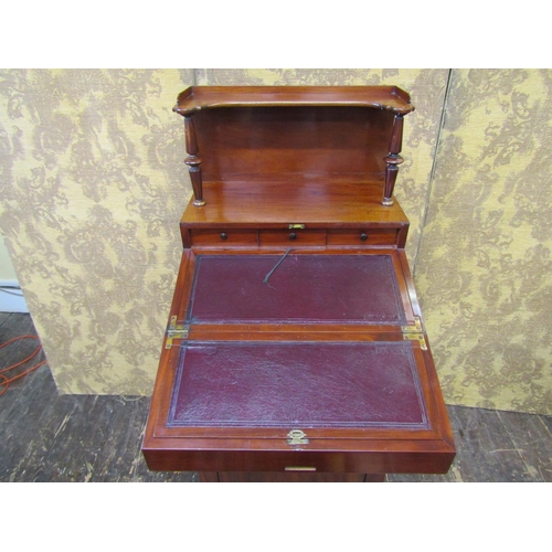 2635 - A Regency mahogany davenport of unusual form, the fold over top revealing a writing surface and thre... 