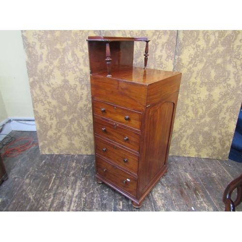 2635 - A Regency mahogany davenport of unusual form, the fold over top revealing a writing surface and thre... 