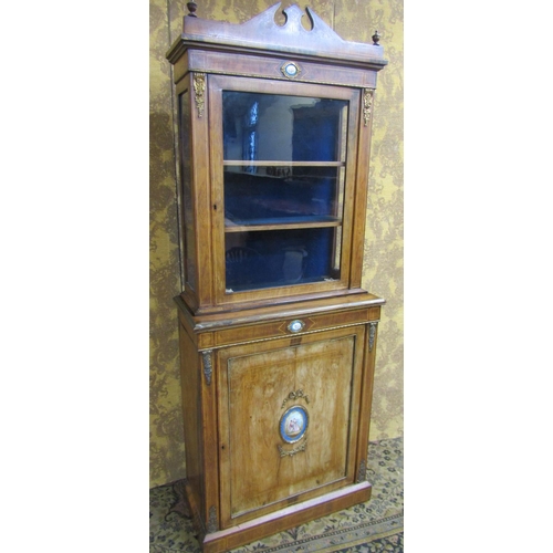 2636 - A matched pair of 19th century French walnut pier cabinets, the lower section enclosed by panelled d... 