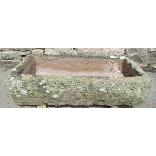 2062 - A weathered natural stone rectangular trough with dished interior, 76cm long x 37cm wide x 18cm deep