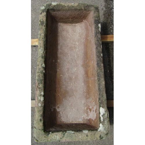 2062 - A weathered natural stone rectangular trough with dished interior, 76cm long x 37cm wide x 18cm deep