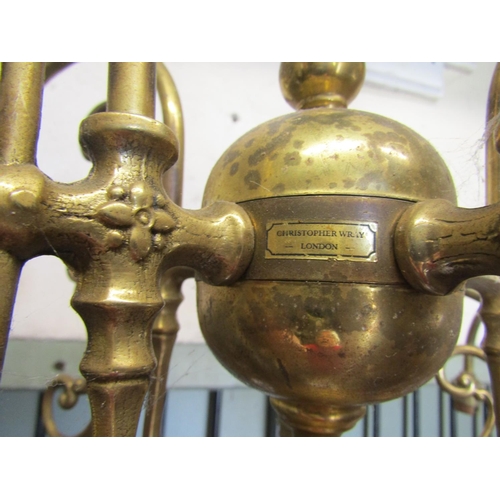 2115 - A pair of cast brass four branch hanging ceiling lights with long stems and scrolling foliate detail... 