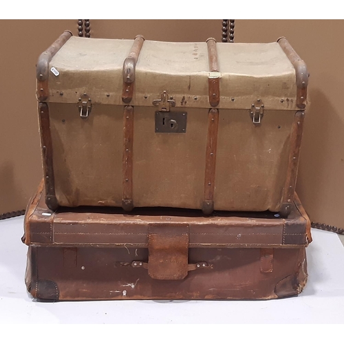 2157 - A Georgian leather overlaid and studded camphor wood trunk with hinged lid and drop side carrying ha... 