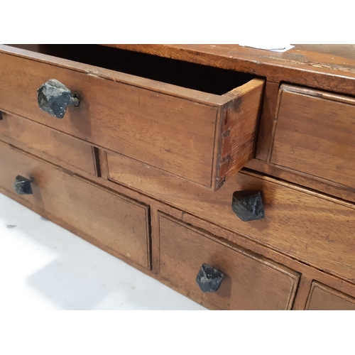 2163 - A vintage/nest of ten mahogany and stain pine drawers 88 cm wide x 24 cm deep x 22 cm high