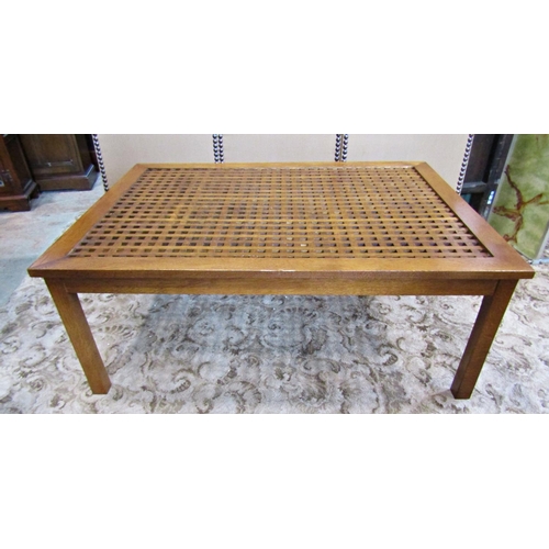 2187 - A contemporary low oak occasional table with rectangular cube patterned lattic top raised on square ... 