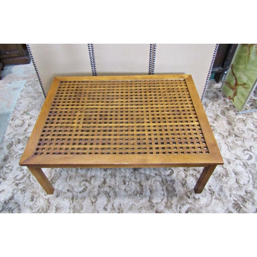 2187 - A contemporary low oak occasional table with rectangular cube patterned lattic top raised on square ... 