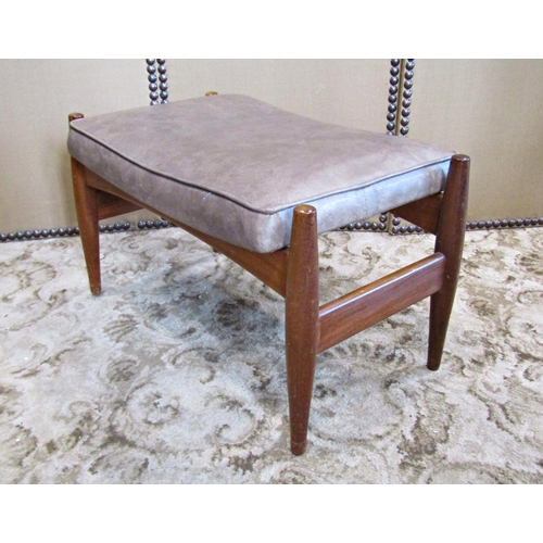 2192 - A mid 20th century teak low dressing stool with rectangular pad seat raised on simple turned tapered... 