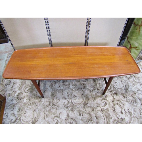 2194 - A vintage retro teak occasional table of rectangular form with shaped and moulded outline raised on ... 