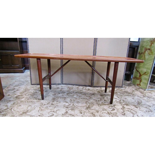 2194 - A vintage retro teak occasional table of rectangular form with shaped and moulded outline raised on ... 