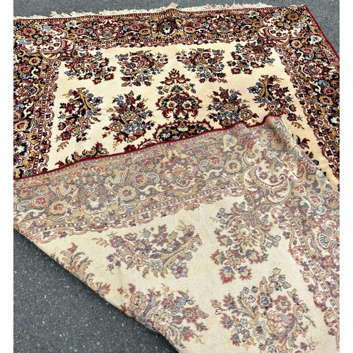 1691 - A Persian design Wilton type machine made carpet with an all over floral pattern on a cream ground  ... 