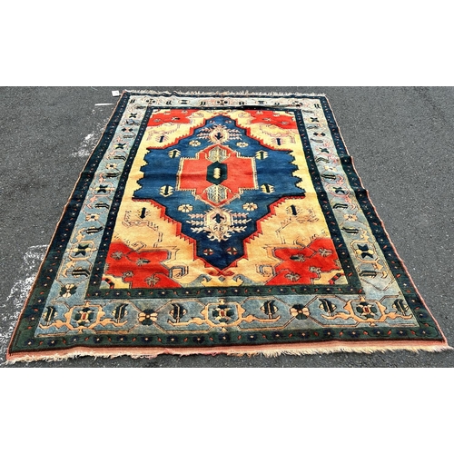 1697 - A thick pile modern Kazak carpet brightly coloured in  orange and blue with a floral border, 272 cm ... 