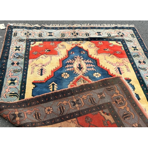 1697 - A thick pile modern Kazak carpet brightly coloured in  orange and blue with a floral border, 272 cm ... 