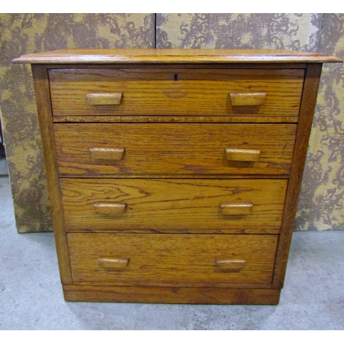 2199 - A medium oak bedroom chest of four long graduated drawers with moulded handles and panelled sides, 9... 