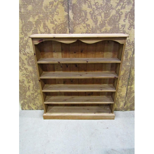 2206 - A small slender floorstanding stripped pine open bookcase with fixed shelves, 90cm wide x 16cm deep ... 