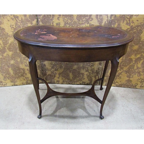 2209 - An Edwardian kidney shaped writing table with inset leather top over two small frieze drawers raised... 