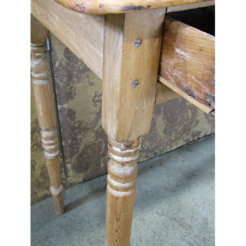 2211 - A Victorian stripped pine side table fitted with a slender frieze drawer raised on ring turned and t... 