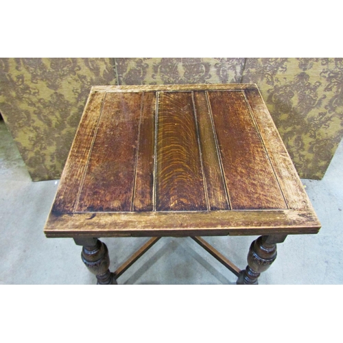 2214 - An oak plank top draw leaf dining table raised on baluster supports united by an X framed stretcher,... 