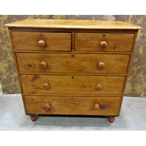 2220 - A Victorian stripped pine bedroom chest of three long and two short graduated drawers raised on turn... 