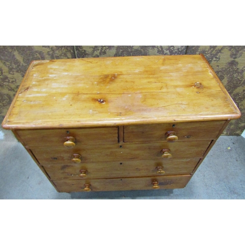 2220 - A Victorian stripped pine bedroom chest of three long and two short graduated drawers raised on turn... 