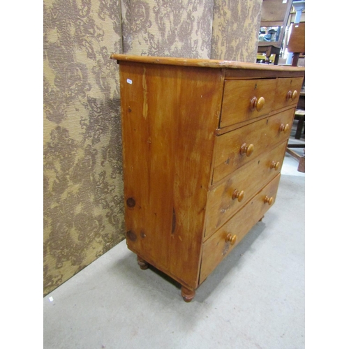 2220 - A Victorian stripped pine bedroom chest of three long and two short graduated drawers raised on turn... 