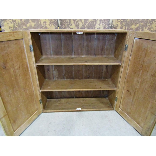 2228 - A Victorian stripped pine side cupboard enclosed by a pair of rectangular panelled doors, 102cm x 33... 