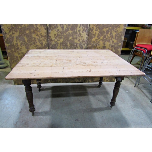 2232 - A Victorian pine drop leaf kitchen table on turned supports, 136cm long x 75cm wide when closed x 12... 