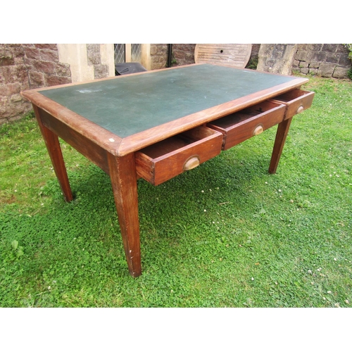 2233 - A mahogany writing desk with inset leather top, with three drawers on square taper legs, 152cm long