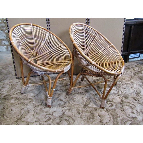 2234 - A pair of mid 20th century cane work conical shaped chairs