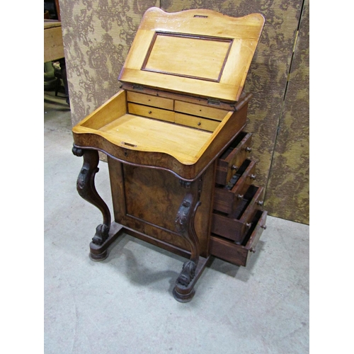 2237 - A Victorian walnut and figured walnut davenport of usual form with cabriole supports and simply fitt... 