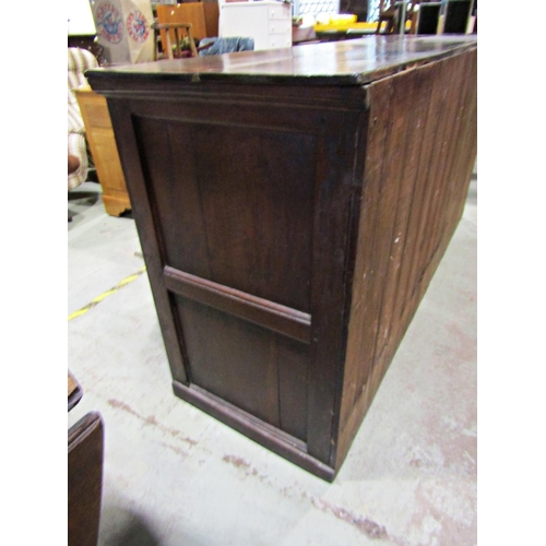 2244 - A Georgian oak dresser base enclosed by a T shaped arrangement of six drawers and two panelled cupbo... 