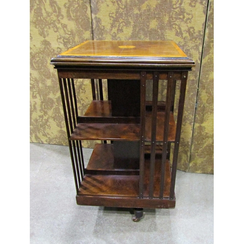 2250 - An inlaid Edwardian rose and satin wood banded revolving bookcase of square cut form, 52cm square