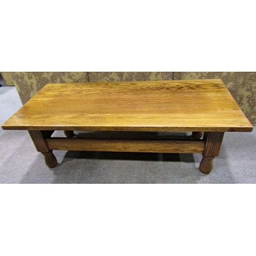 2251 - A pale oak occasional table on turned supports, 130cm long