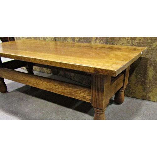 2251 - A pale oak occasional table on turned supports, 130cm long