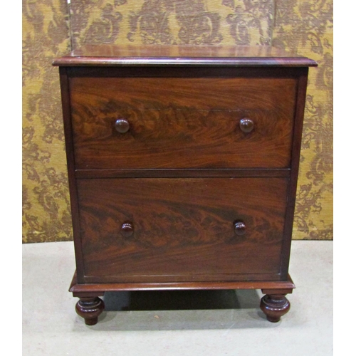 2254 - A Georgian mahogany commode with rising lid, the front elevation presented  as two drawers on bun su... 