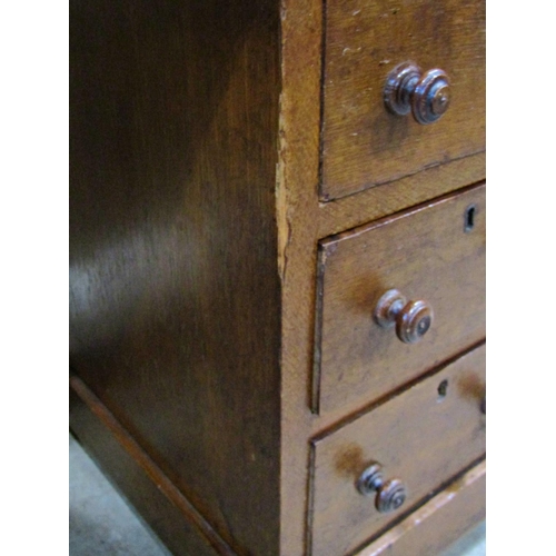 2259 - A Victorian oak pedestal writing desk of nine drawers with inset top, 122cm wide