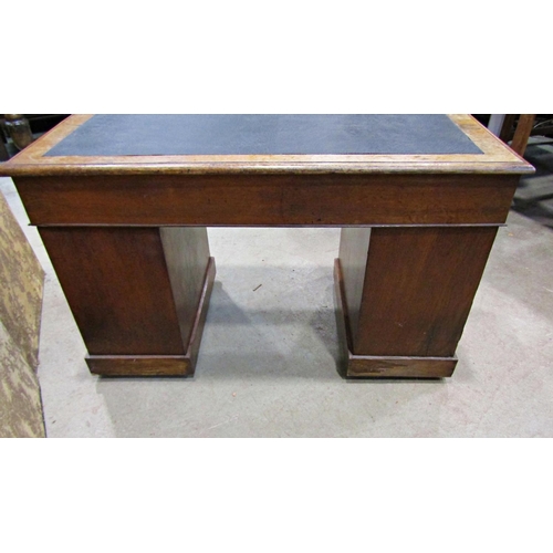 2259 - A Victorian oak pedestal writing desk of nine drawers with inset top, 122cm wide