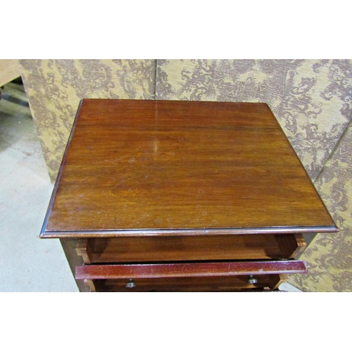 2260 - An inlaid Edwardian mahogany music cabinet of four drawers raised on an open framework, 50cm wide