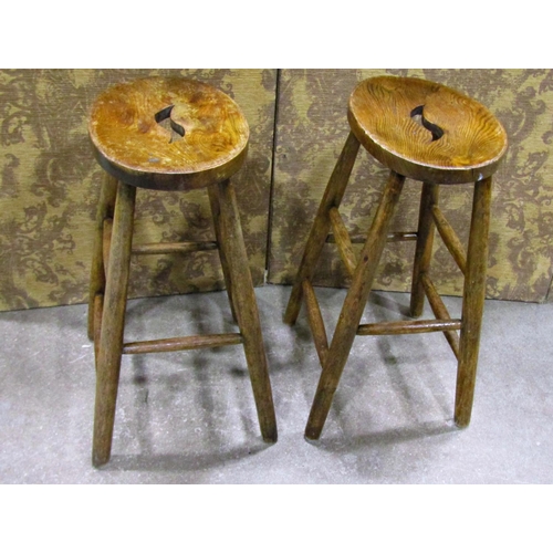 2261 - A pair of shop stools, with elm seats on turned beechwood supports, 61cm high