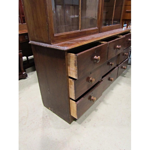 2263 - 19th century mahogany shop cabinet, the lower section enclosed by nine drawers, the upper section by... 