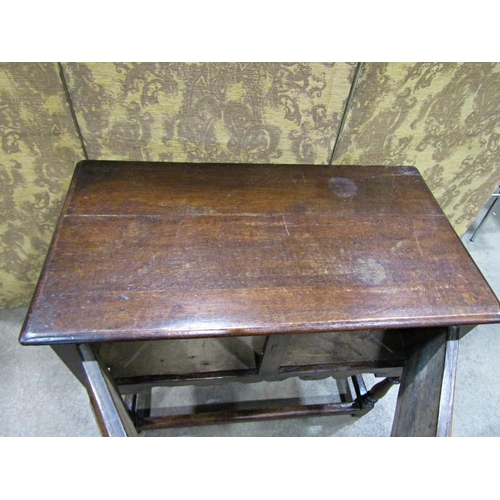 2265 - An old English oak side table in a Jacobean style the front elevation enclosed by two cupboards (dis... 