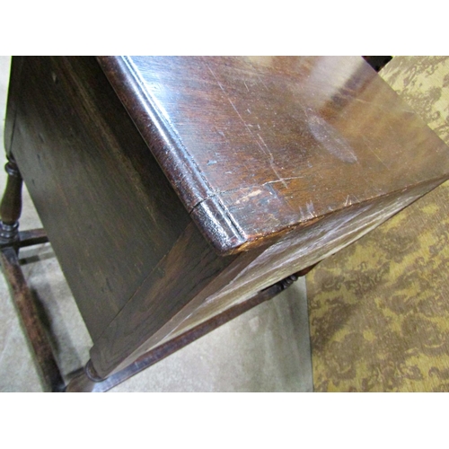 2265 - An old English oak side table in a Jacobean style the front elevation enclosed by two cupboards (dis... 