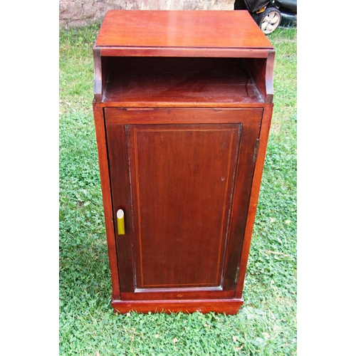 2273 - A pair of inlaid Edwardian mahogany bedside cupboards enclosed by panelled doors