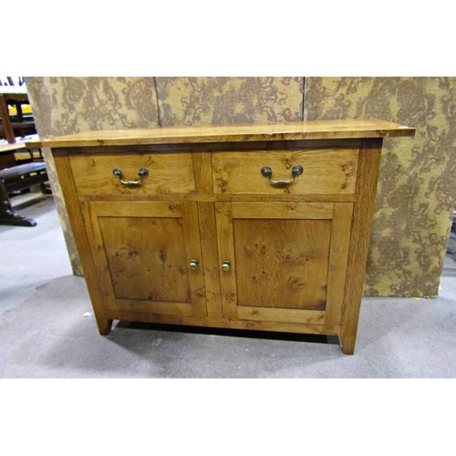 2278 - A good quality contemporary oak side cupboard enclosed by two frieze drawers and two cupboard doors,... 