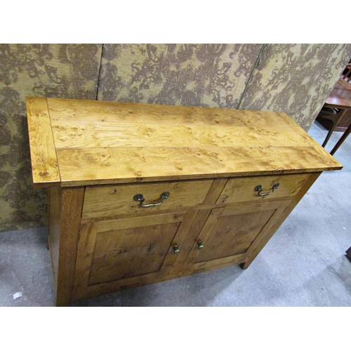 2278 - A good quality contemporary oak side cupboard enclosed by two frieze drawers and two cupboard doors,... 