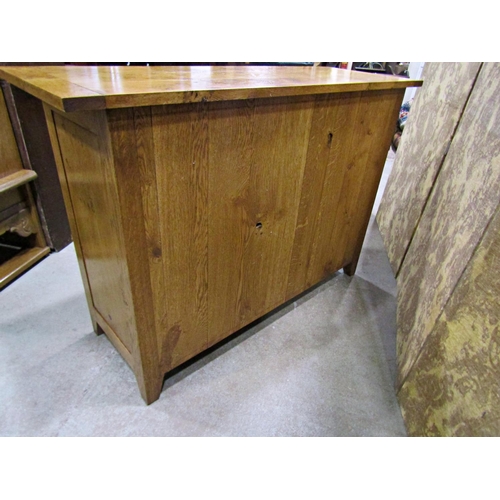 2278 - A good quality contemporary oak side cupboard enclosed by two frieze drawers and two cupboard doors,... 