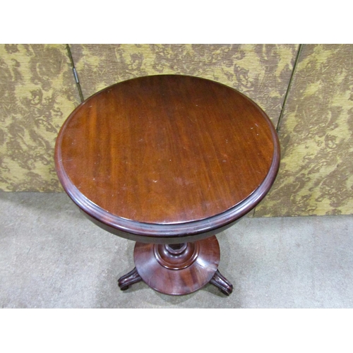 2285 - A Victorian mahogany occasional table, the circular top on an inverted octagonal stem and platform b... 